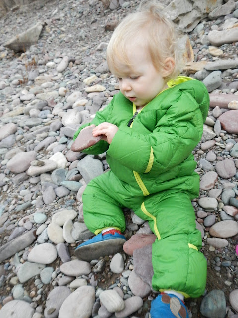 toddler exploring rocks and nature blackfoot river montana